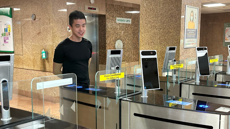 Man using facial recognition automated visitor system